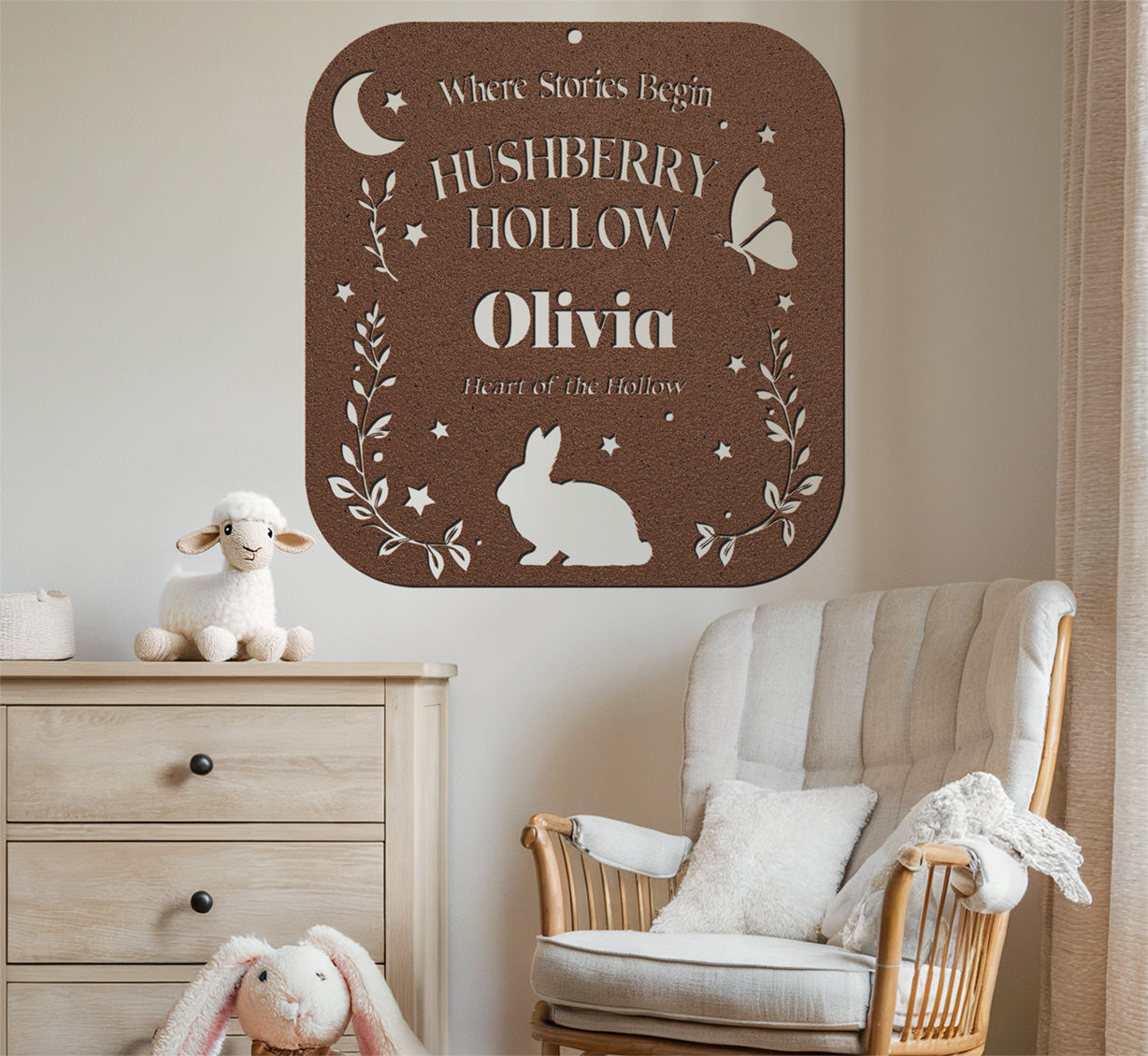 Decorative wall sign with 'Hushberry Hollow Olivia' in a nursery setting.