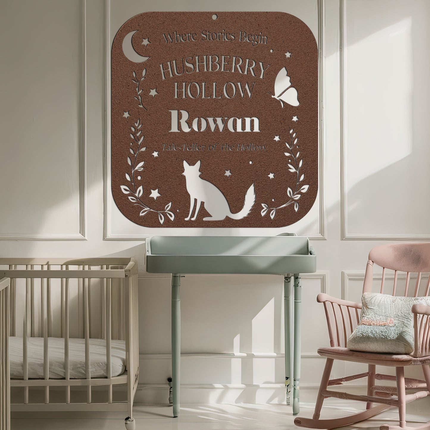 Nursery room with a sign reading 'Hushberry Hollow Rowan' above a crib and rocking chair.