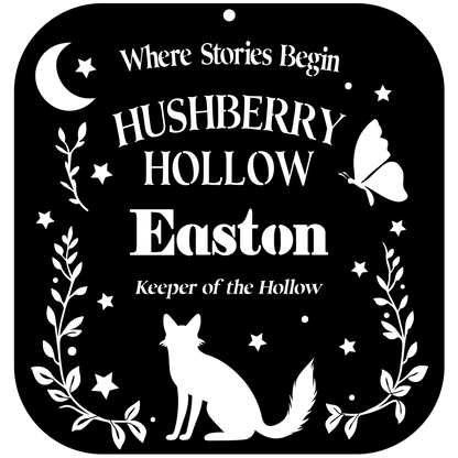 Decorative sign with 'Hushberry Hollow Easton' text and fox silhouette on a black background